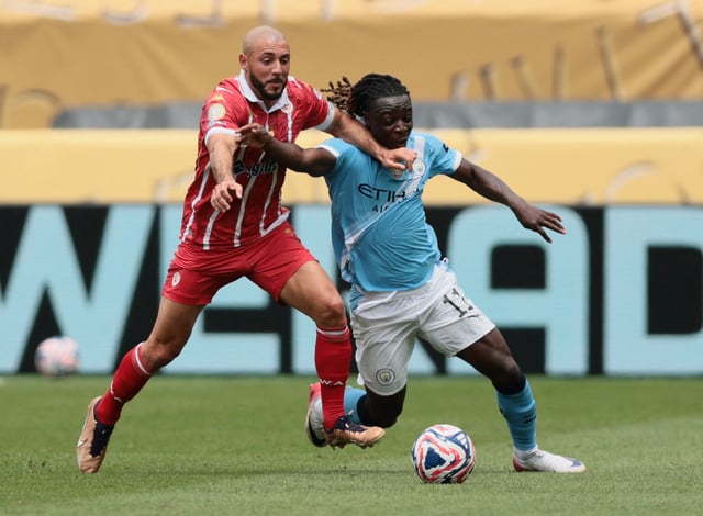 Soccer Football - FIFA Club World Cup - Group G - Manchester City v Wydad Casablanca - Lincoln Financial Field, Philadelphia, Pennsylvania, U.S. - June 18, 2025 Manchester City's Jeremy Doku in action with Wydad Casablanca's Nordin Amrabat IMAGN IMAGES via Reuters/Caean Couto