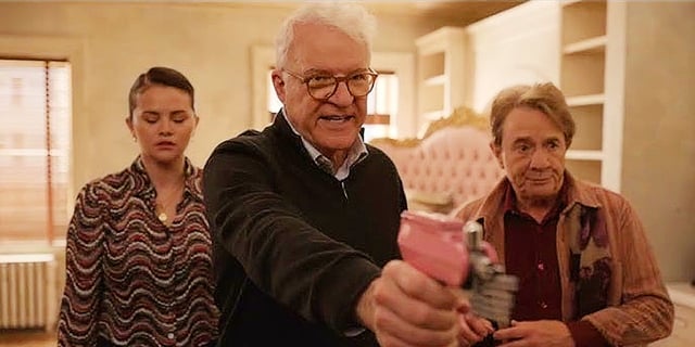 Charles protecting Mabel and Oliver with a multitool in Only Murders in the Building Season 4, Episode 10. 