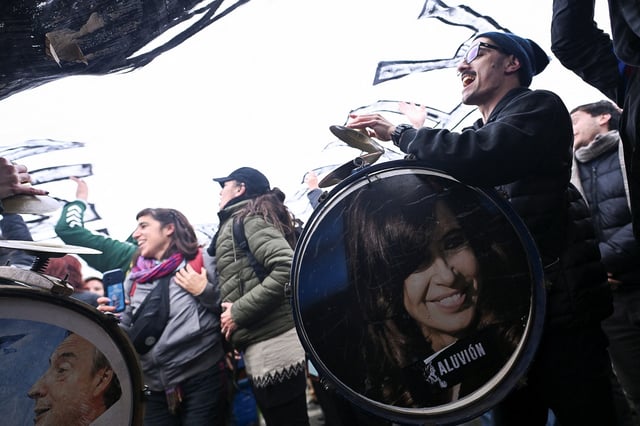 Supporters of Argentina's former President Cristina Fernandez de Kirchner cheer outside her house, after an Argentine judge approved her request to serve out her six-year prison sentence for corruption at home, in Buenos Aires, Argentina, June 18, 2025. REUTERS/Martin Cossarini