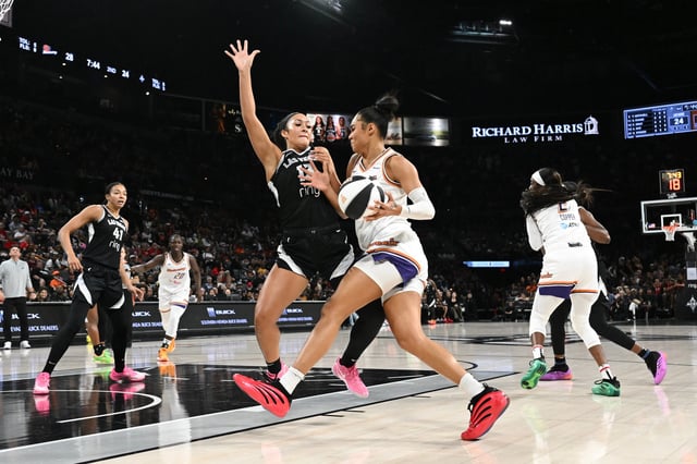 Phoenix Mercury forward Satou Sabally drives on Las Vegas Aces guard Aaliyah Nye during Phoenix's 76-70 road win on June 15.