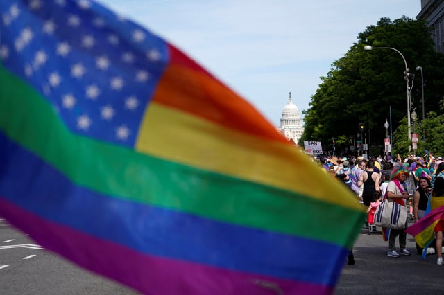 A flag waves as people take part in the annual LGBTQ+ Capital Pride parade in Washington, U.S., June 8, 2024. REUTERS/Nathan Howard