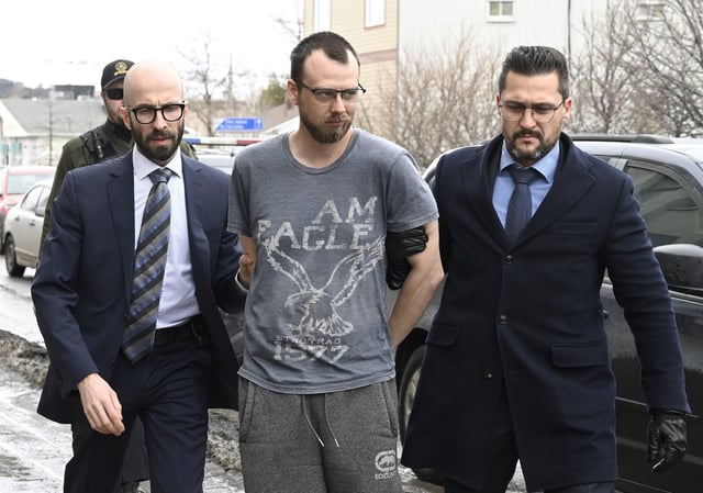 Steeve Gagnon is escorted by police into court in Amqui, Que., Tuesday, March 14, 2023. THE CANADIAN PRESS/Jacques Boissinot