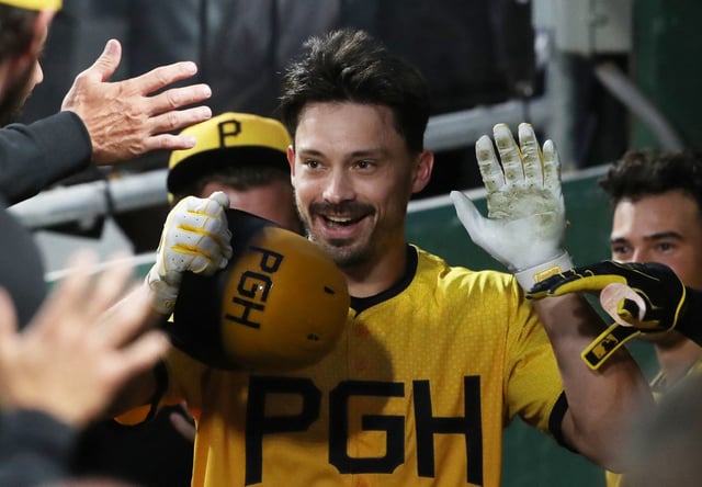 Jun 6, 2025; Pittsburgh, Pennsylvania, USA;  Pittsburgh Pirates right fielder Bryan Reynolds (10) celebrates his  solo home run in the dugout against the Philadelphia Phillies during the third inning at PNC Park. Mandatory Credit: Charles LeClaire-Imagn Images/File Photo