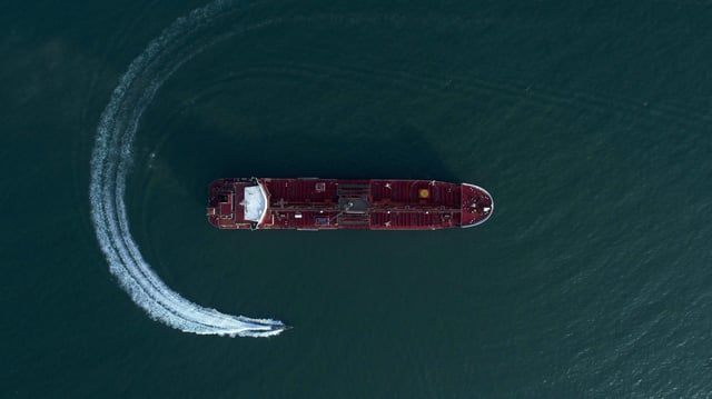  Iranian Revolutionary Guards in speedboats patrolling the British-flagged oil tanker Stena Impero, which was seized in the Strait of Hormuz on Friday by the Guard, in the Iranian port of Bandar Abbas. Global stock markets were subdued Monday while the price of oil climbed as tensions in the Persian Gulf escalated after Iran's seizure of a British oil tanker.  Iran, Persian Gulf, on July 21, 2019. Photo by SalamPix/ABACAPRESS.COM