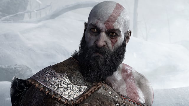 Kratos looks at his son, Atreus, in God of War: Ragnarok