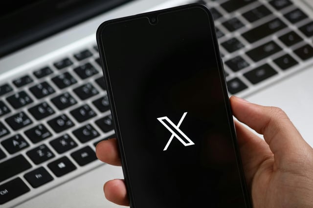X logo on a smartphone