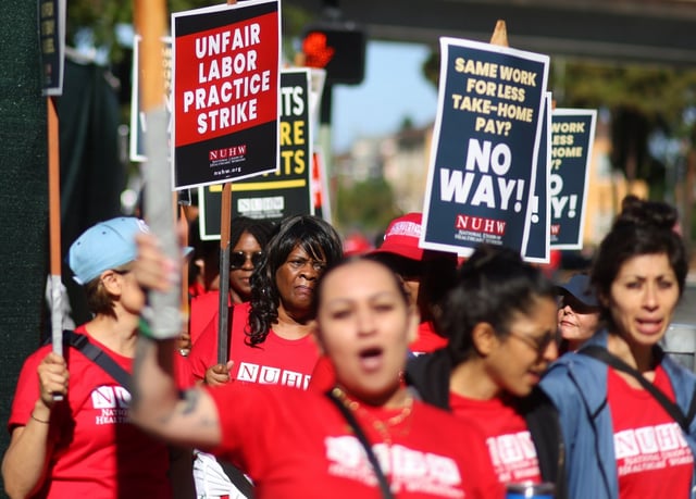 Members and supporters of the National Union of Healthcare Workers take part in a strike outside UCSF Benioff Children’s Hospital Oakland on Wednesday, June 18, 2025, in Oakland, Calif.  At issue is transfer of workers into public-sector unions whose contracts could leave workers with less take-home pay because they are required to pay toward their health and retirement benefits. (Aric Crabb/Bay Area News Group)