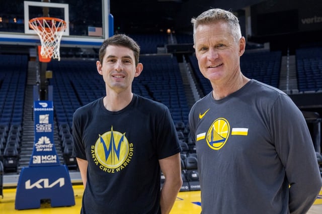 Nicholas Kerr, head coach of the Santa Cruz Warriors, and his father Steve Kerr, head coach of the Golden State Warriors, meet on the court at Chase Center in San Francisco, Calif., Wednesday, Dec. 27, 2023. (Karl Mondon/Bay Area News Group)