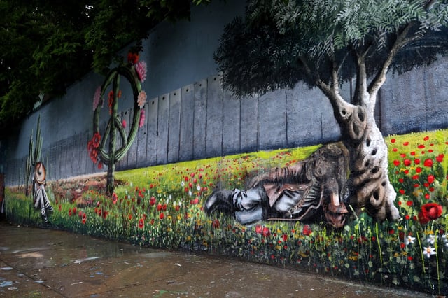 A vandalized mural along 16th Street near Ashland Avenue in Chicago’s Pilsen neighborhood on June 18, 2025. (Antonio Perez/Chicago Tribune)