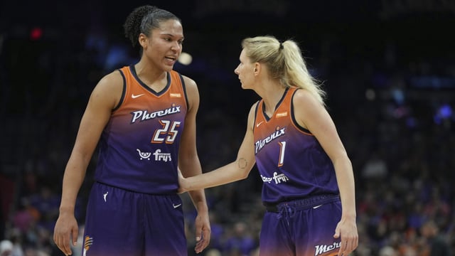 Phoenix Mercury forward Alyssa Thomas (25) and guard Alexa Held (1) during a WNBA basketball game against the Seattle Storm in Phoenix, Saturday, May 17, 2025. (AP Photo/Rick Scuteri)