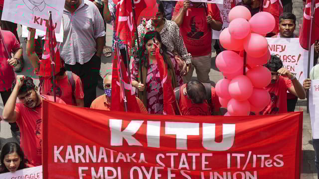 Members of various trade unions take part in a rally in Bengaluru on May 1, 2025.