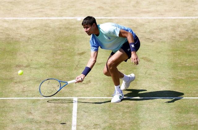 Tennis - Queen's Club Championships - Queen's Club, London, Britain - June 18, 2025 Australia's Alexei Popyrin in action during his round of 16 match against Britain's Jack Draper Action Images via Reuters/Peter Cziborra