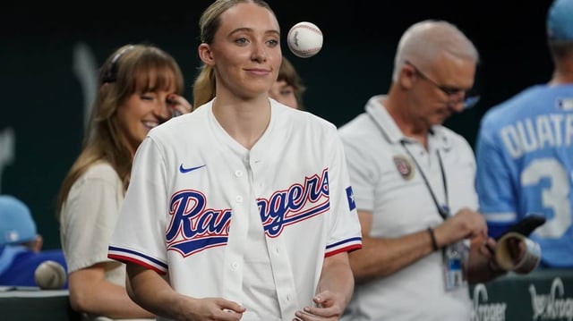 Dallas Wings point guard Paige Bueckers prepares to throw out the first pitch prior to game between the Texas Rangers and the Kansas City Royals at Globe Life Field.