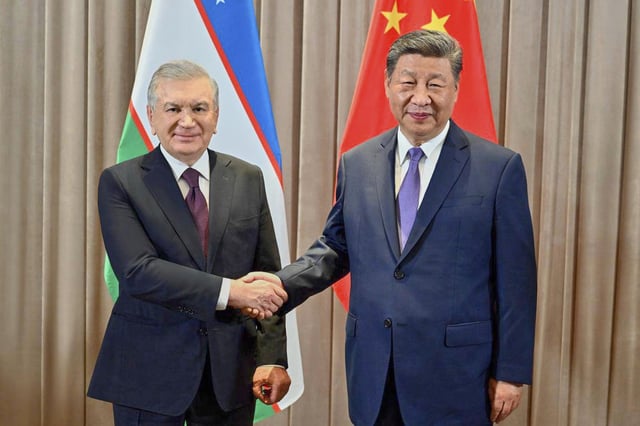 In this photo released by Uzbekistan&#39;s Presidential Press Service, Uzbekistan&#39;s President Shavkat Mirziyoyev, left, and Chinese President Xi Jinping pose for a photo during their meeting on the sidelines of the China-Central Asia Summit in Astana, Kazakhstan, on June 17, 2025.