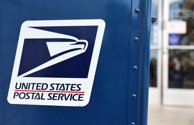 A United States postal Service logo is displayed on a U.S. Post Office mailbox on April 1, 2024 in Montclair, California.