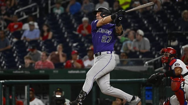 Jun 18, 2025; Washington, District of Columbia, USA; Colorado Rockies left fielder Jordan Beck (27) hits a solo home run against the Washington Nationals during the eighth inning at Nationals Park. Mandatory Credit: Brad Mills-Imagn Images