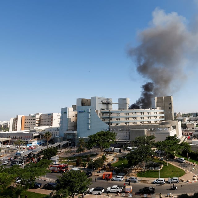 Smoke rises from the Soroka Medical Center following a missile strike from Iran on Israel, June 19.