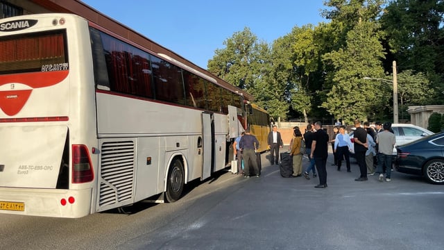This photo, provided by the foreign ministry in Seoul on June 19, 2025, shows South Koreans and their Iranian family members boarding a bus during their evacuation from Iran to Turkmenistan. (PHOTO NOT FOR SALE) (Yonhap)