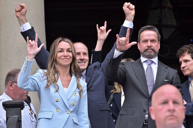 Karen Read gestures to supporters after she was found not guilty of second-degree murder on Wednesday, June 18, 2025, in Dedham, Mass. (AP Photo/Josh Reynolds)