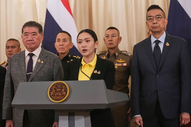 Thailand's Prime Minister Paetongtarn Shinawatra, center, talks to reporters at Government house in Bangkok, Thailand, on June 19, 2025.