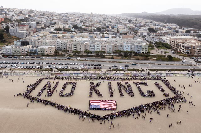 People form a human banner at Ocean Beach during the &#34;No Kings&#34; protests in San Francisco on Saturday, June 14, 2025.