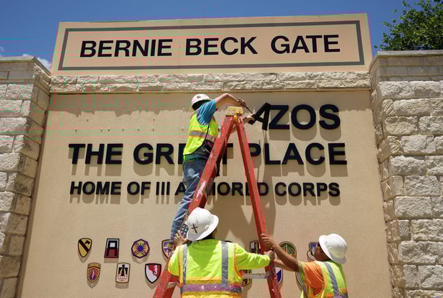 Jose Carrillo, with the Army Corps of Engineers, removes the sign at Fort Cavazos in preparation for the Army post name change back to Fort Hood. Three former soldiers who were stationed at Fort Hood have received prison sentences for smuggling unauthorized immigrants into the U.S., according to federal officials.