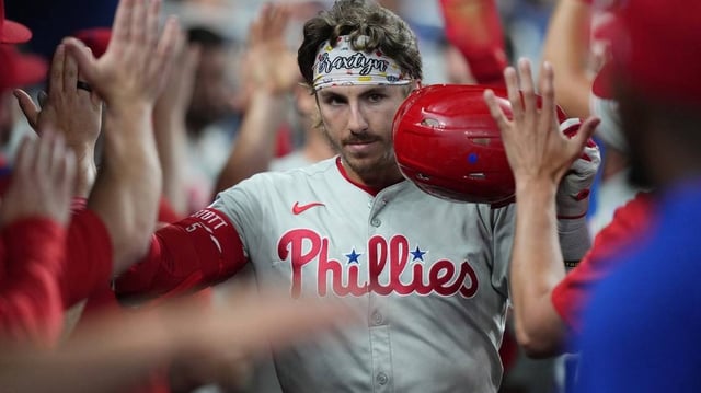Jun 18, 2025; Miami, Florida, USA;  Philadelphia Phillies second baseman Bryson Stott (5) celebrates a three-run home run against the Miami Marlins in the fourth inning at loanDepot Park. Mandatory Credit: Jim Rassol-Imagn Images