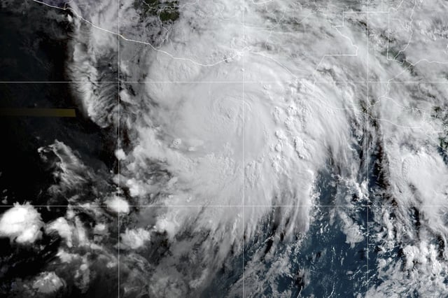 This satellite image provided by the National Oceanic and Atmospheric Administration (NOAA) shows Hurricane Erick approaching Mexico's Pacific coast, Wednesday morning, June 18, 2025. 