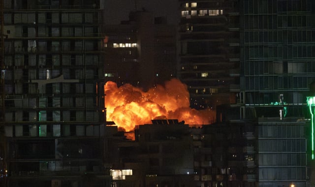 TEL AVIV, ISRAEL - JUNE 16: Smoke and flame rise after Iranian strikes hit a building as Iran's ongoing retaliatory attacks with ballistic missiles towards Israel are seen from Tel Aviv, Israel on June 16, 2025. (Photo by Mostafa Alkharouf/Anadolu via Getty Images)