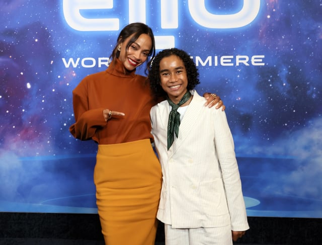 Zoe Saldaña poses with co-star Yonas Kibreab at the Hollywood world premiere of Disney/Pixar's "Elio."