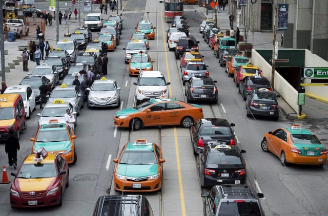 Taxis are seen in Toronto on Monday, June 1, 2015. THE CANADIAN PRESS/Nathan Denette