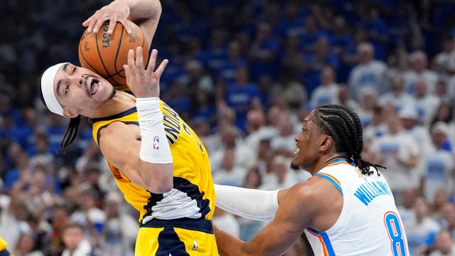Indiana Pacers guard Andrew Nembhard (2) in action against Oklahoma City Thunder forward Jalen Williams (8) during the second quarter of game five of the 2025 NBA Finals at Paycom Center. 