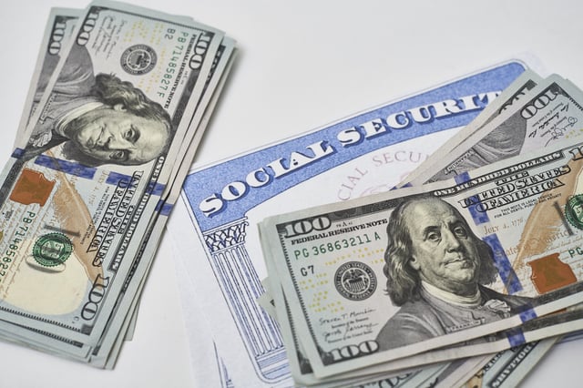 Stock image/file photo: A Social Security card with U.S. Dollars.
