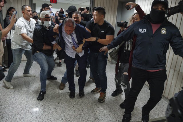New York City Comptroller Brad Lander is placed under arrest by Immigration and Customs Enforcement (ICE) and FBI agents outside federal immigration court on Tuesday, June 17, 2025, in New York.