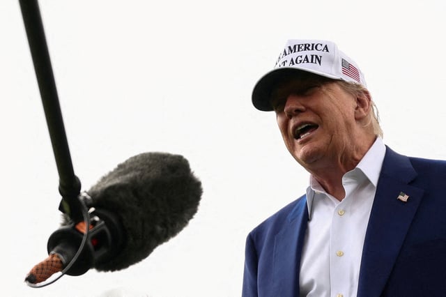 U.S. President Donald Trump speaks to members of the media during the installation of a new flagpole on the South Lawn at the White House in Washington, D.C., U.S., June 18, 2025.  REUTERS/Kevin Lamarque