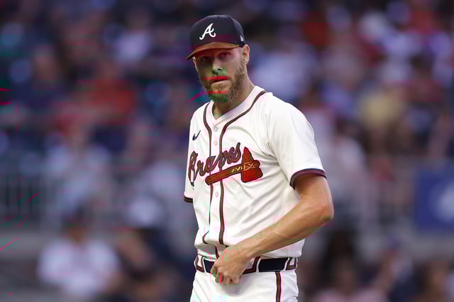 ATLANTA, GEORGIA - SEPTEMBER 3: Chris Sale #51 of the Atlanta Braves returns to the dugout during the third inning against the Colorado Rockies at Truist Park on September 3, 2024 in Atlanta, Georgia.