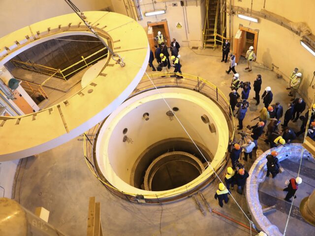 FILE - In this photo released by the Atomic Energy Organization of Iran, technicians work at the Arak heavy water reactor's secondary circuit, as officials and media visit the site, near Arak, Iran, Dec. 23, 2019. The United Nations’ atomic watchdog said Thursday, Sept. 7, 2022, that it believes Iran has continued to increase its stockpile of highly enriched uranium, and also voiced increasing concern over Tehran's lack of engagement with a probe that has become a sticking point in efforts to revive the Islamic Republic's nuclear deal with world powers. (Atomic Energy Organization of Iran via AP, File)