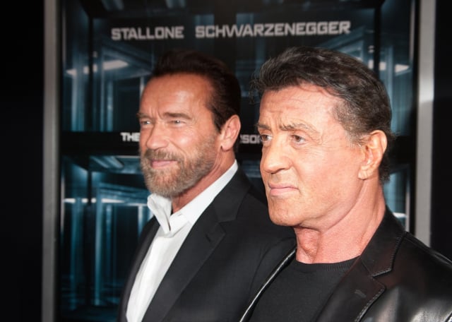 NEW YORK, NY – OCTOBER 15:  Actor Arnold Schwarzenegger and Sylvester Stallone attends “Escape Plan” New York Premiere at Regal E-Walk on October 15, 2013 in New York City.  (Photo by Dave Kotinsky/Getty Images)