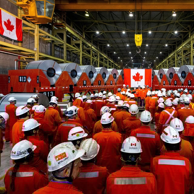 Minister of Industry Mélanie Joly speaks to a group of workers after touring the ArcelorMittal Dofasco steel plant in Hamilton in early June.
