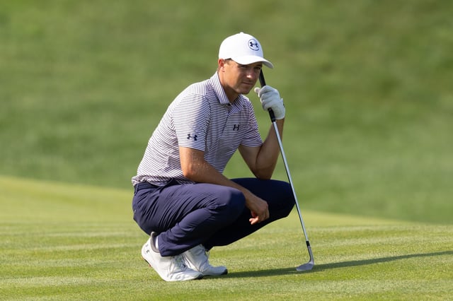 Jun 19, 2025; Cromwell, Connecticut, USA; Jordan Spieth crouches while waiting to play his shot on the 12th hole during the first round of the Travelers Championship golf tournament. Mandatory Credit: Bill Streicher-Imagn Images/File Photo