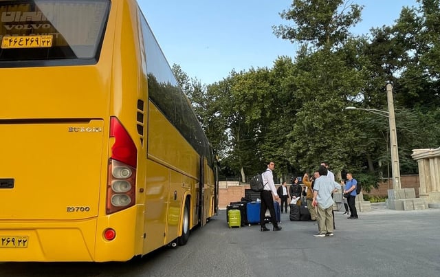 South Korean nationals and their Iranian family members board a bus in Tehran to cross the border into Turkmenistan during an evacuation, in this photo provided by Seoul's foreign ministry on June 19, 2025. (PHOTO NOT FOR SALE) (Yonhap)