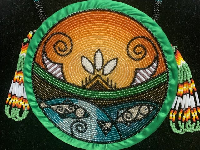 This traditional embroidery of the Wolastoqey Nation's emblem displays the river at the heart of their communities, the Wolastoq, better known as the Saint John River.
