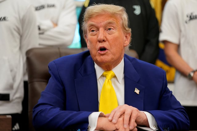 U.S. President Donald Trump speaks with the media accompanied by players of the Juventus soccer team, in the Oval Office of the White House in Washington, D.C., U.S., June 18, 2025. REUTERS/Nathan Howard