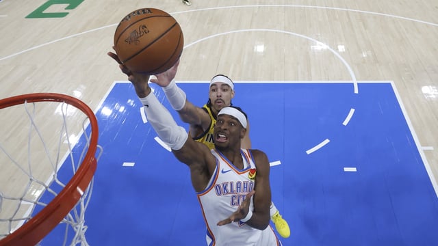 Oklahoma City Thunder guard Shai Gilgeous-Alexander (2) shoots against Indiana Pacers guard Andrew Nembhard (2) during game five of the 2025 NBA Finals at Paycom Center.