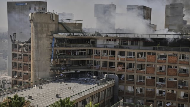 Smokes rises from a building of the Soroka hospital complex after it was hit by a missile fired from Iran in Beersheba, Israel on Thursday.