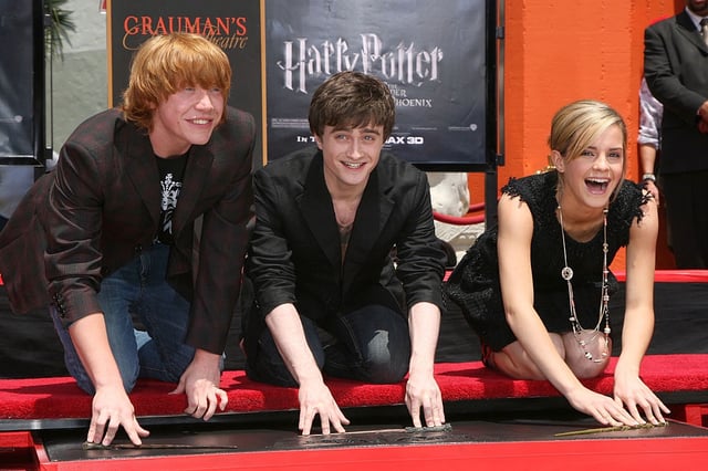 HOLLYWOOD - JULY 9:  (L-R) Actor Rupert Grint, actor Daniel Radcliffe and actress Emma Watson attend the Harry Potter cast &#34;Hand, Foot and Wand-Print&#34; ceremony held at Grauman&#39;s Chinese Theater July 9, 2007 in Hollywood, California. (Photo by Alberto E. Rodriguez/Getty Images)