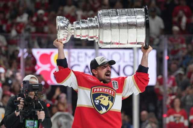 Florida Panthers center Brad Marchand skates with the Stanley Cup after defeating the Edmonton Oilers in Game 6 of the NHL hockey Stanley Cup Final Tuesday, June 17, 2025, in Sunrise, Fla. (AP Photo/Lynne Sladky)