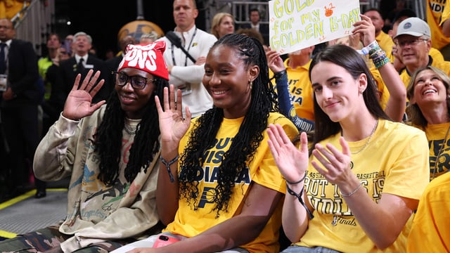 (L to R) Natasha Howard, Aliyah Boston, and Caitlin Clark of the Indiana Fever look on during the second quarter in Game Three of the 2025 NBA Finals between the Indiana Pacers and the Oklahoma City Thunder at Gainbridge Fieldhouse on June 11, 2025 in Indianapolis, Indiana.