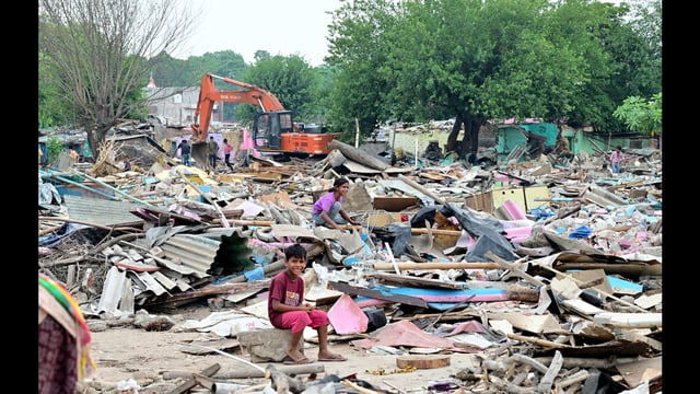 Amid the demolition drive, a girl sifts through the rubble while another kid looks on in Adarsh Colony, Chandigarh, on Thursday. (Ravi Kumar/HT)