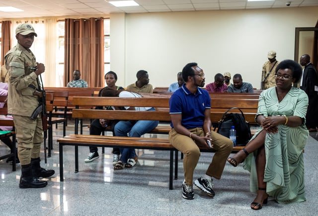 Rwandan Opposition politician and leader of the unregistered Development And Liberty For All (DALFA) party Victoire Ingabire talks to Rwandan lawyer and opposition politician Bernard Ntaganda, inside the High Court in Kigali, Rwanda June 19, 2025. REUTERS/Jean Bizimana